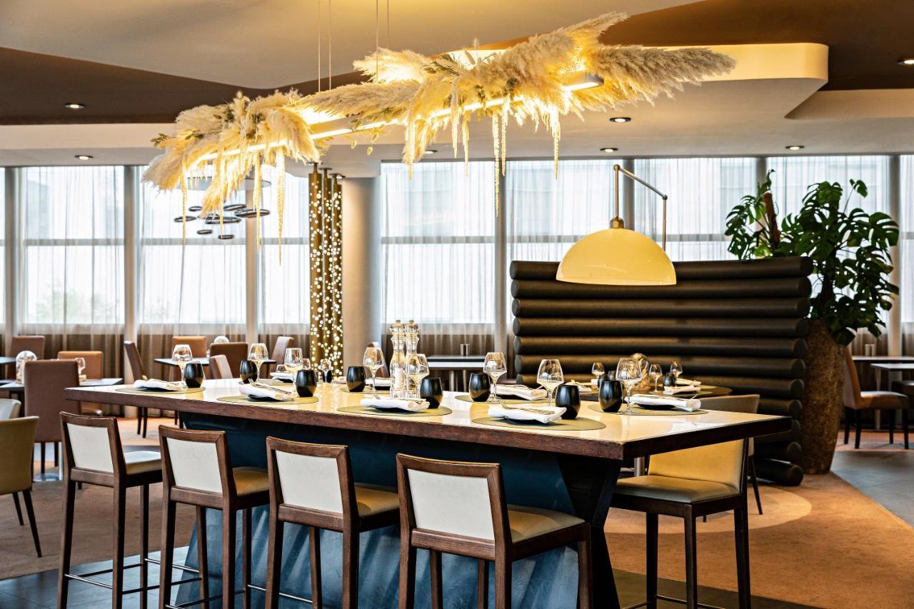 铂尔曼巴黎德芬斯度假酒店 库尔布瓦 外观 照片 The interior of the restaurant